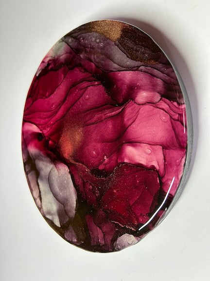 Wall decor abstract paintings symbolising rebirth, strength and resilience. A creation of burgundy and copper in a circular abstraction of 8 inches.