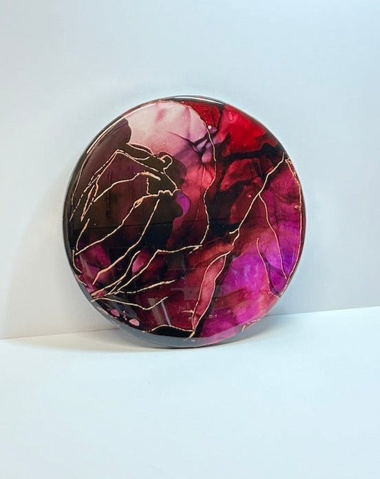 Symbiosis - an original painting full of jewel tones of dark purple and red-violet that saturate. Veins of metallic copper branch out atop the heated colours, adding another layer to the elemental energy. Aura expressed artwork by Inkandescent Arts. Original resin red abstract wall art expression. RED RESIN ABSTRACT WALLART