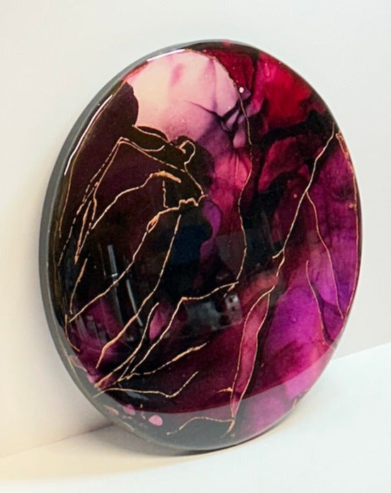 A painting of self acceptance. Symbiosis is a jewel toned, glossy, abstract wall art painting with multiple layers of resin, giving a glass like finish and depth. Elegant beauty for your home by Inkandescent Arts.