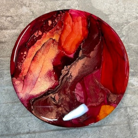 An expression of reawakening  the life-force within.  Resin, abstract fluid art painting featuring tones of deep red, orange-red, metallic copper and gold.  Wall art by Inkandescent Arts. Original resin red abstract wall art expression.  RED WALL ART ART FOR THE HOME. SMALL LUXURY WALL ART.