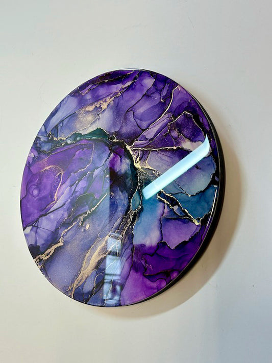 A purple abstract resin wall art painting representing romantic myth and portals from the underworld - magical, ethereal doorways with wildflower colours and metallic glints. ANIMA is an abstraction topped in multiple resin layers, giving depth and reflective shine - another aspect of a fantasy portal from the otherworld that this painting expresses.
