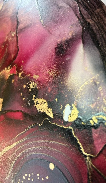 Detail of abstract painting in red, black and gold showing ethereal and bold tones, lines and patches. Mystical artwork phoenix symbolism - a symbol of rebirth and renewal.  Part of a circular 10 inch painting by Inkandescent Arts.