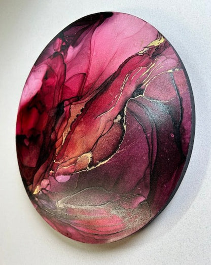 CARDINAL - EXPRESSIVE created wallart delving into self belief and willpower featuring ruby and aubergine shades interspersed with gold. A red circular 10” original abstract painting for interiors by Inkandescent Arts.