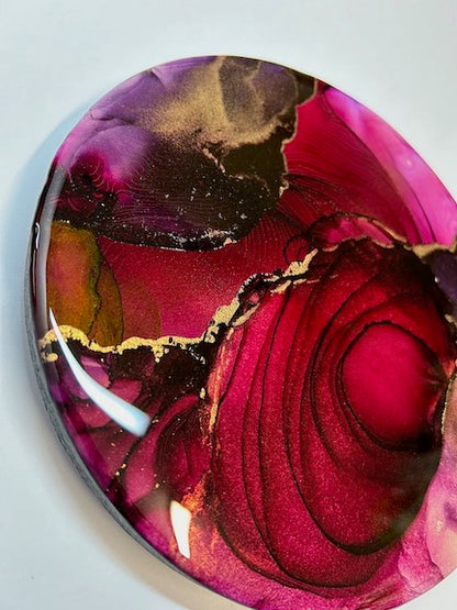 Wall decor in a circular design with a bold, luscious colour of deep sunset, making an attractive, eye catching abstract painting. Luxury wall art for the living room.
