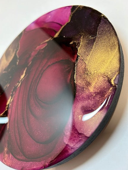 For a bedroom, warm colours of deep red, hot pink, lavender and brass delicacies. A richly coloured red abstract with fractures and spirals. 
By Inkandescent Arts.
