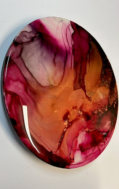 Abstract art piece with swirling colours on a white background. A symbol of transformation and renewal through a round painting of modern decor and elegant luxury.