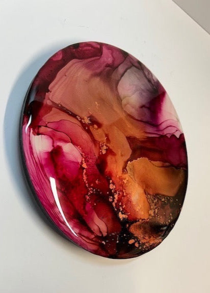 Phoenix art, a symbol of the mythical fire bird. An abstraction of dusty pink and copper with a glossy exterior. 
