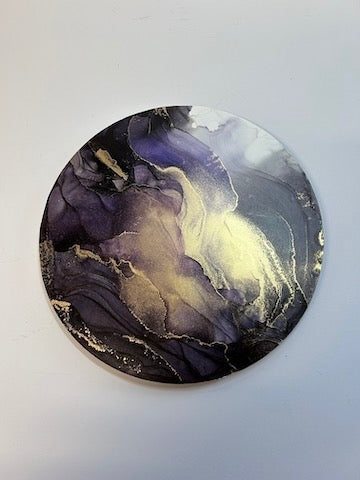 Gold and grey abstract art. A round, surreal painting of birds flying into a stormy portal. A symbol of rebirth and transformation as we go through lifes trials - facing difficulties head on and bounce back with renewed purpose as we move on - by Inkandescent Arts.
