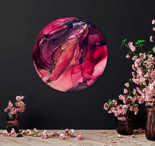 Round wall decor abstract painting in burgundy, red and 23k gold leaf, on a black wall with floral decorations.  Abstract art for goths and rebirth symbolism in art.  Enliven your dark interior with original art of cosy and warm colours.