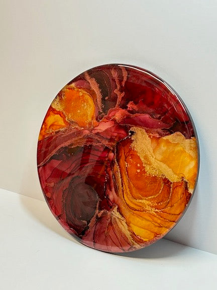 Room decoration for men. Fiery, vibrant art of deep red and sunset orange with ebbs and fluctuations of lines, depths and contours. A phoenix representation of courage, strength and rebirth.
