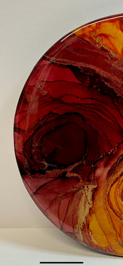 Modern art featuring red, orange and the metallic elements of copper and gold with a composition of deep rifts and valleys.
A story of resilience, courage and transformation inspired by the Phoenix rising.
