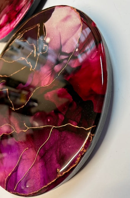 Kintsugi art displayed angled, featuring lush, deep, warm colours and depth of red, ruby, purple and copper leaf. Healing art related to Phoenix symbolism it represents overcoming challenges                and embracing change - by Inkandescen