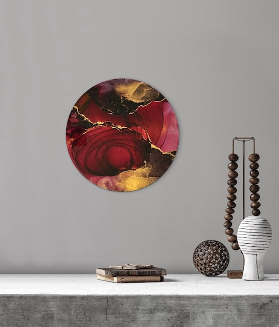 Transformative artwork on a wall above a mantle. Depth filled in vibrant colour this  luxury interior art lies rooted in strength through adversity. Dark red and gold abstract wall art by Inkandescent Arts.
