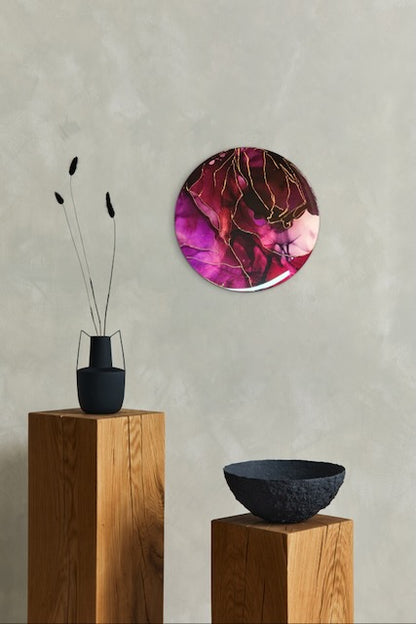 Modern wall art adorns a wall over ornaments on wooden plinths. Depth filled art in maroon red and copper leaf lines it explores themes of rebirth symbolism and major changes. Abstract painting by Inkandescent Arts.
