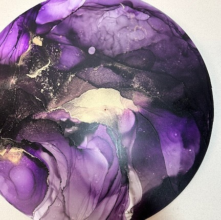Abstract art piece with purple and gold colors on a white background