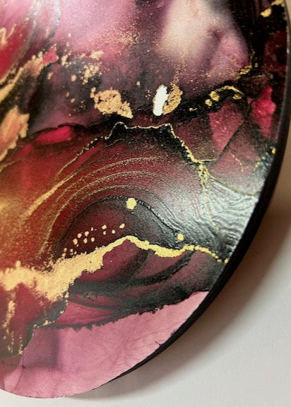 Modern abstract wall decor, INSTINCT is a dreamy abstraction in wine red and charcoal with golden metallics. Dark elegance for small spaces.
