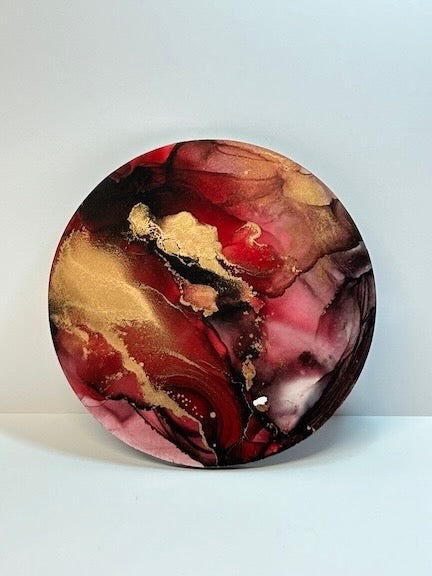 Circular original abstract art; ethereal art of dark red and gold. Artwork with symbolism of the phoenix and rebirth and rising from adversity. 