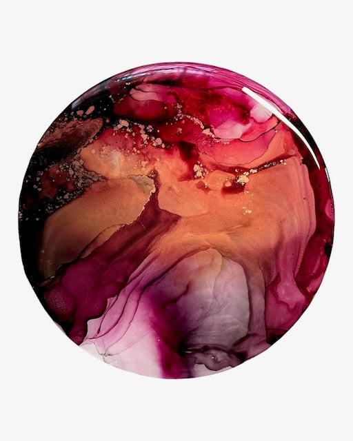Circular art of vibrant energy on a white wall. This contemporary abstraction shows the bold and lighter shades and patterns within the painting. New beginnings art by Inkandescent Arts.