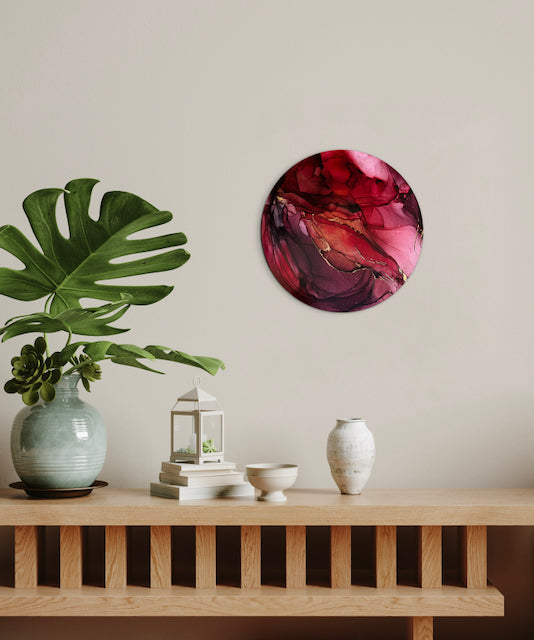 A red abstraction adorns a wall over a mantle, plants and ornaments. Modern wall art for the home by Inkandescent Arts.