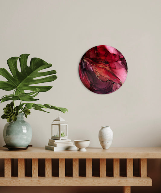 A red abstraction adorns a wall over a mantle, plants and ornaments. Modern wall art for the home by Inkandescent Arts.