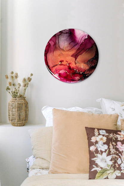 Abstract symbolism art of transformation and rebirth; wall decor art of metallic copper and rose pink on a white living room wall over cushions and sofa. Round artwork for cosy and warm rooms.