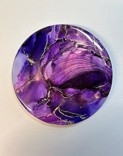 Deep purple circular artwork with real 23kt gold leaf detail of a mystical storm portal. Inkandescent Arts