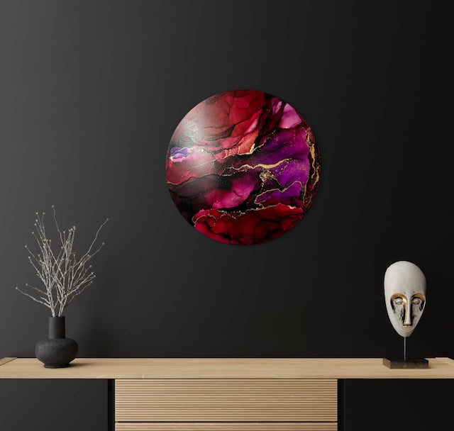 Modern living room art on a dark wall above a sideboard and black ornaments.
This original abstract art features jewel tones of purple and dark red with metallic brass highlighting depth and colour and would befit your home with energy and sophistication. Art by Inkandescent Arts.
